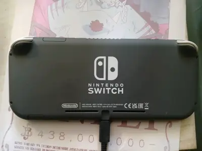 Consola Nintendo Switch Lite gris en buen estado - miniatura 3