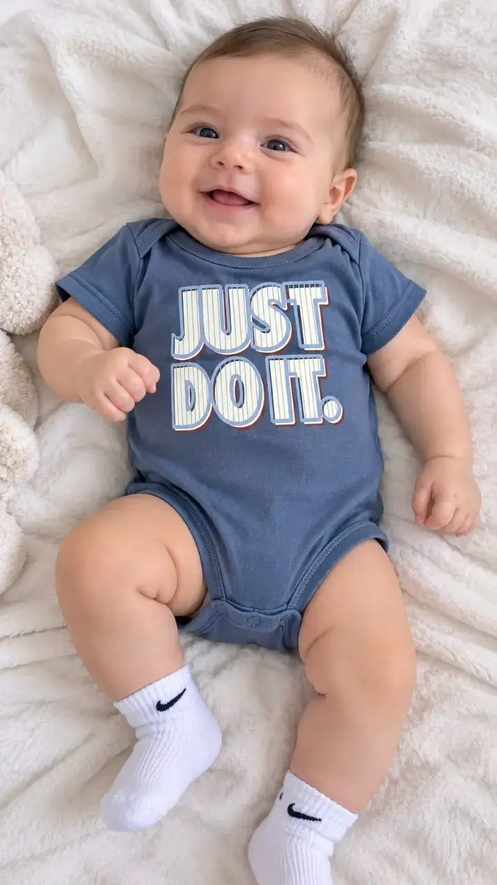 Body NIKE de bebé azul con estampado 'Just Do It'
