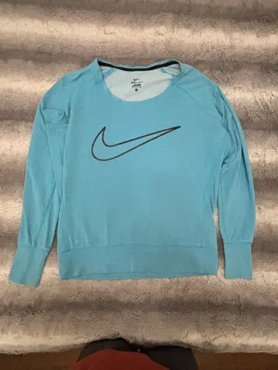 Polera deportiva Nike Dri-Fit azul para mujer - miniatura 1