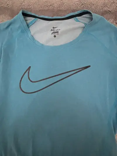 Polera deportiva Nike Dri-Fit azul para mujer - miniatura 2