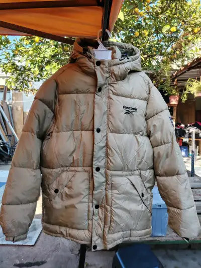 Chaqueta acolchada Reebok beige con capucha - miniatura 1