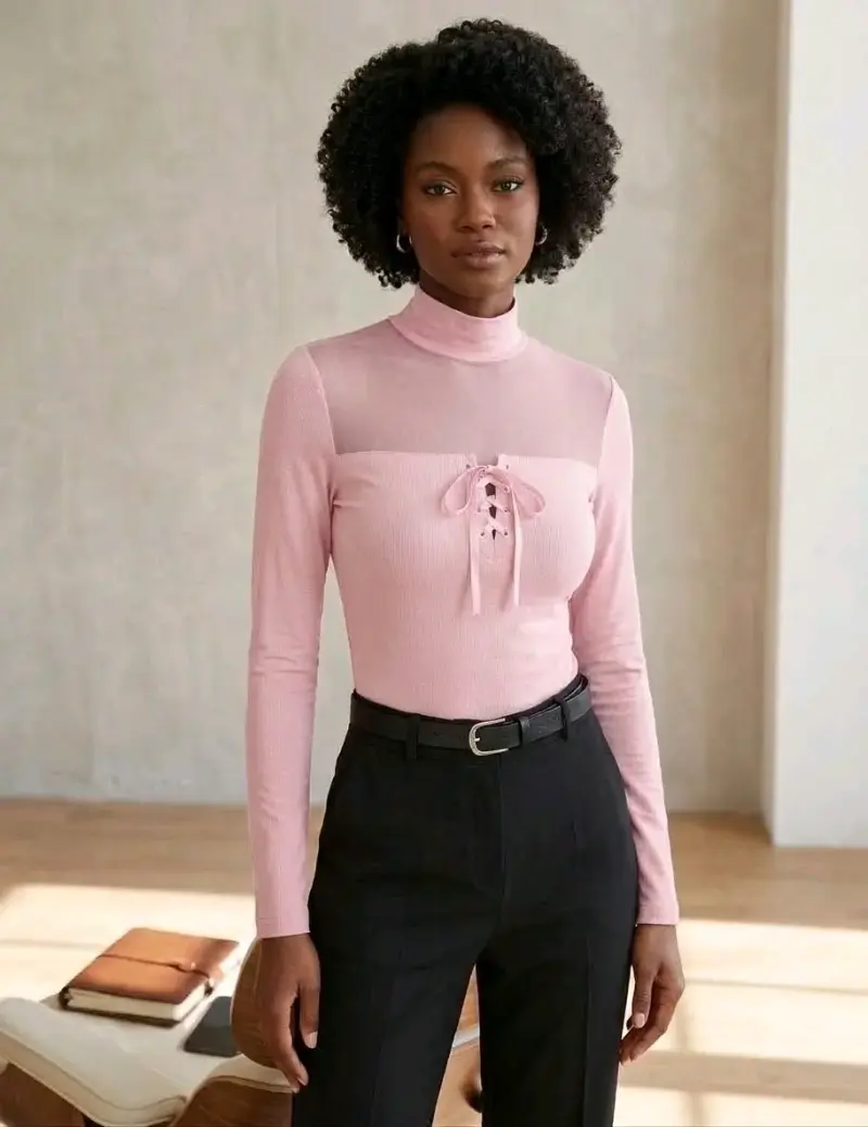 Polera de manga larga rosa con diseño de lazo