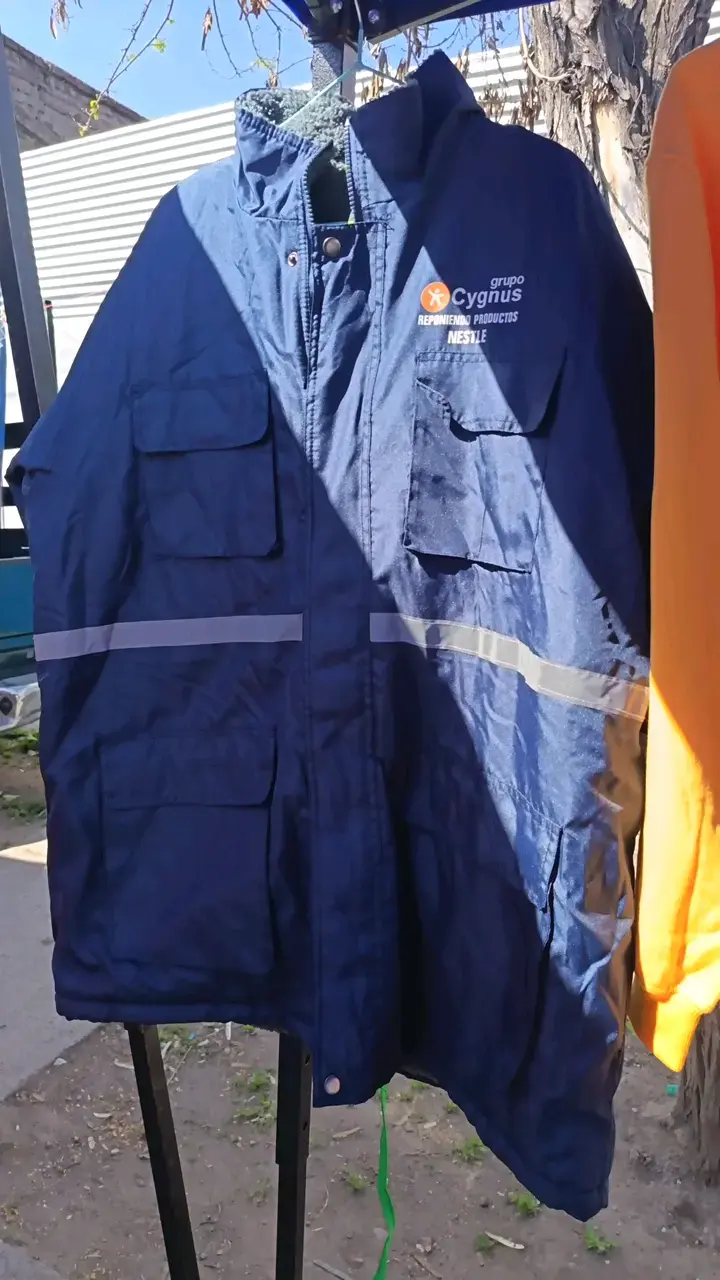 Chaqueta de trabajo azul con logo Cygnus