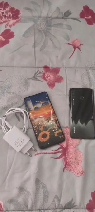Smartphone Huawei con funda y cargador - miniatura 3