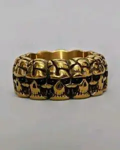 Anillo de calaveras dorado estilo gótico - miniatura 1