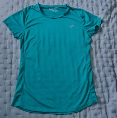 Polera deportiva azul New Balance para mujer - miniatura 1