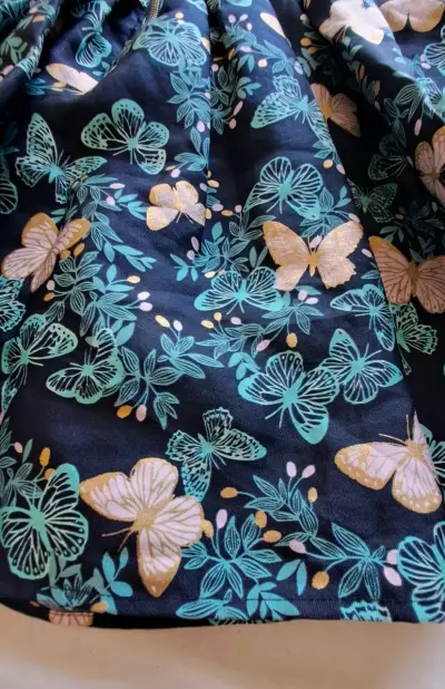 Vestido infantil azul con estampado de mariposas - miniatura 4