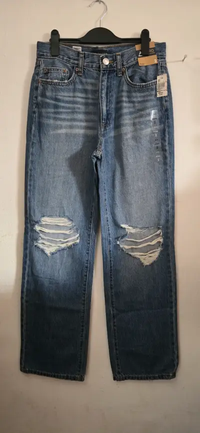 Jeans azules desgastados para mujer - miniatura 1