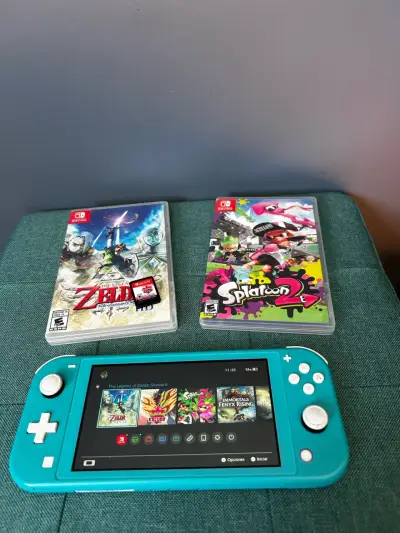 Nintendo Switch Lite turquesa con juegos Zelda y Splatoon - miniatura 1