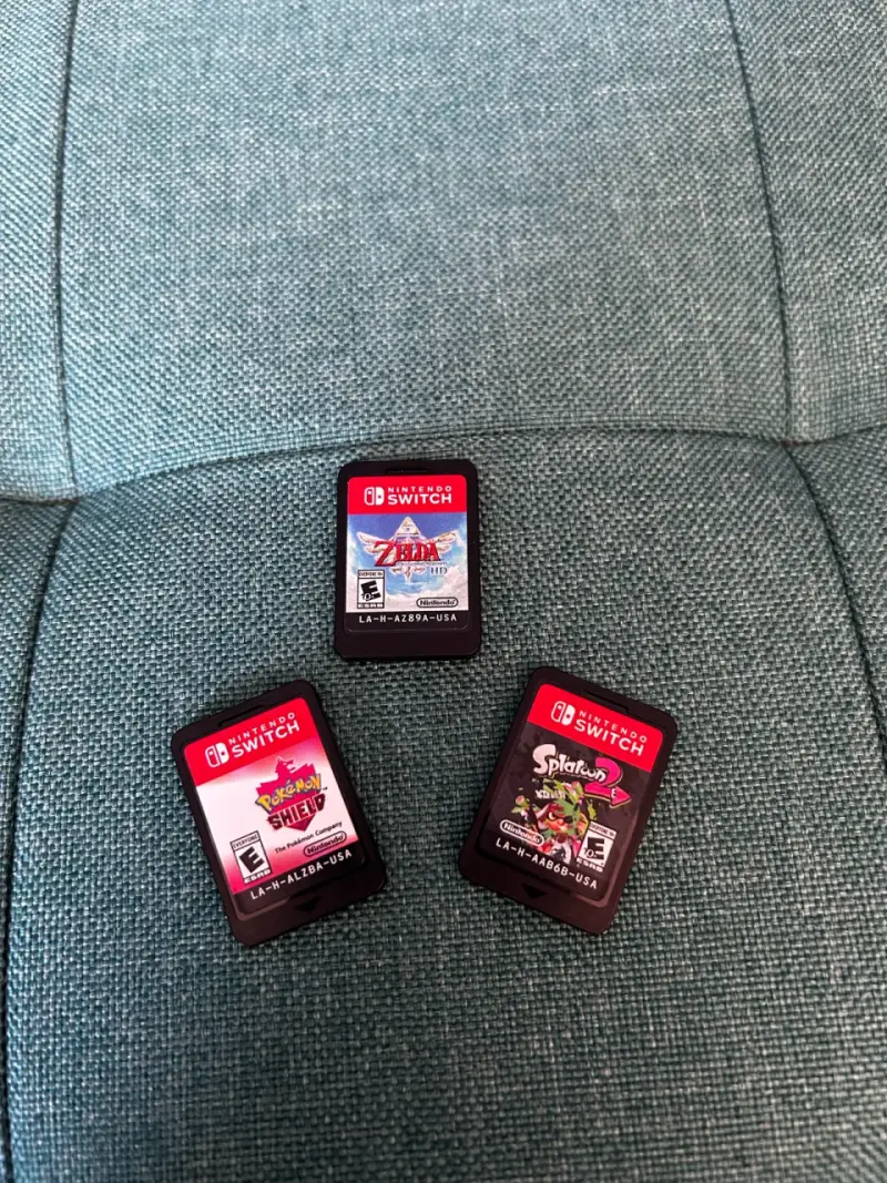 Nintendo Switch Lite turquesa con juegos Zelda y Splatoon - 2