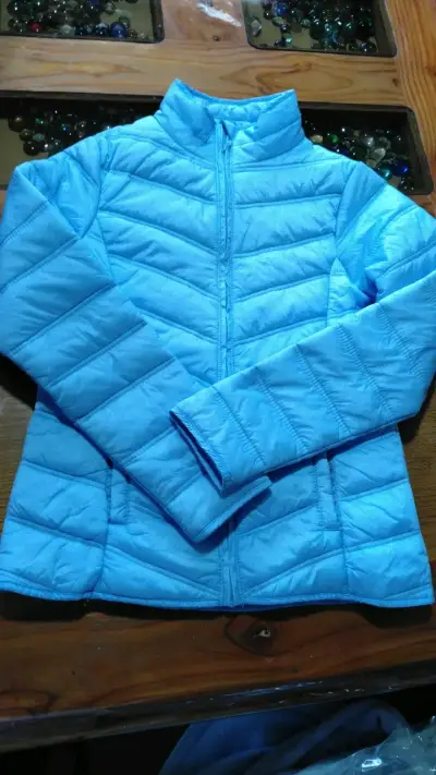 Chaqueta acolchada azul para mujer - miniatura 1