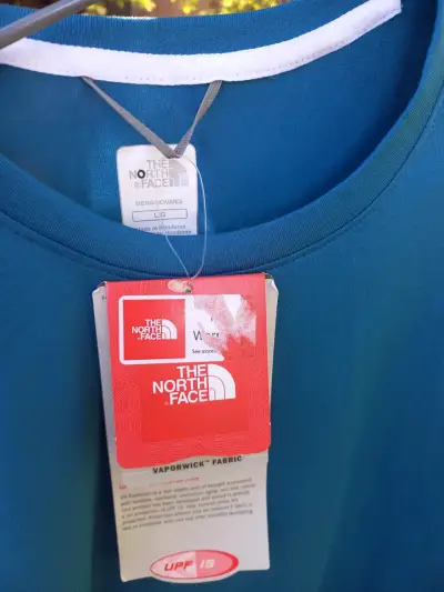 Polera azul The North Face para hombre - miniatura 2