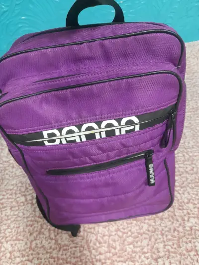 Mochila morada Danna con múltiples compartimentos - miniatura 1
