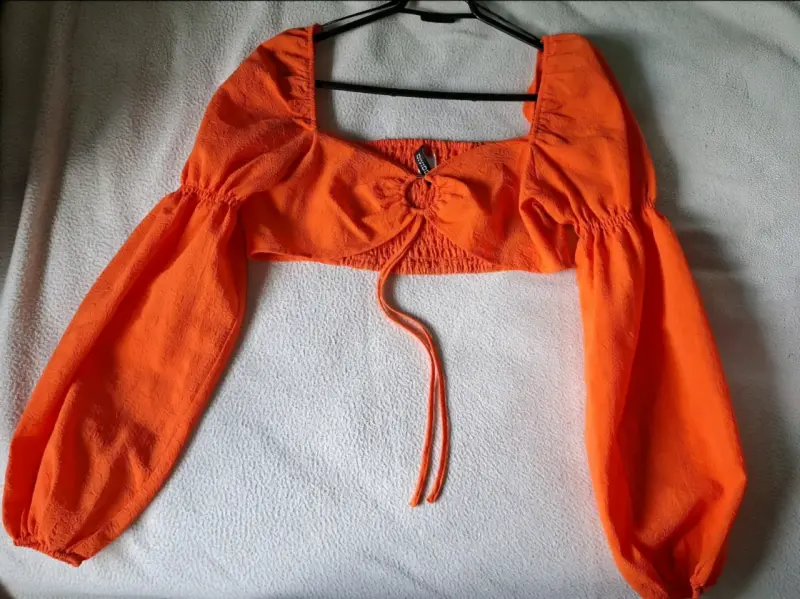 Top naranja mangas largas