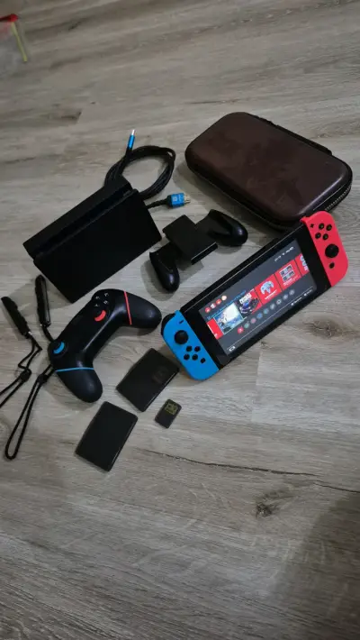 Nintendo Switch con juego, controles y accesorios - miniatura 1