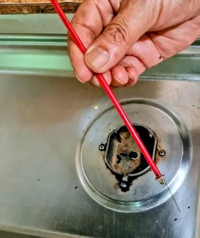 Herramienta de limpieza para quemadores de cocina - miniatura 1