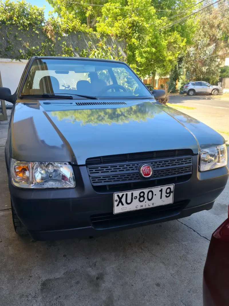 Auto Fiat Uno Fire en buen estado - 1