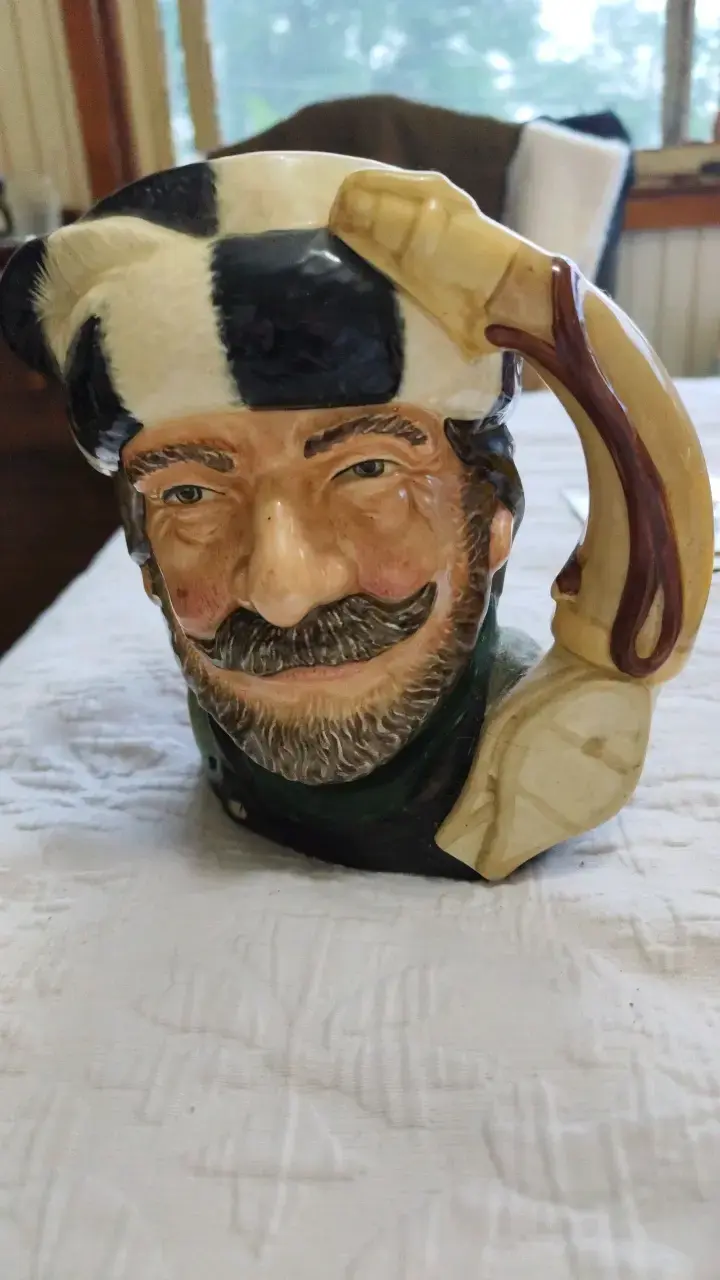 Jarra decorativa de cerámica con diseño de rostro