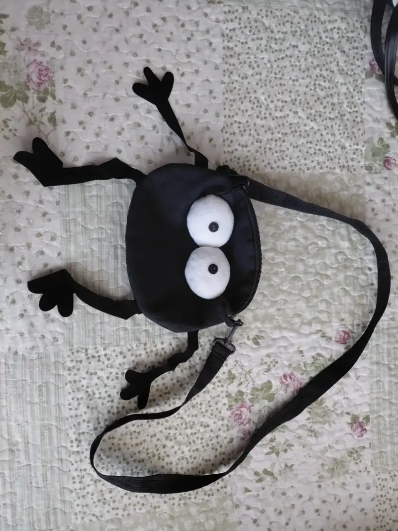 Bolso bandolera infantil con diseño de ojos