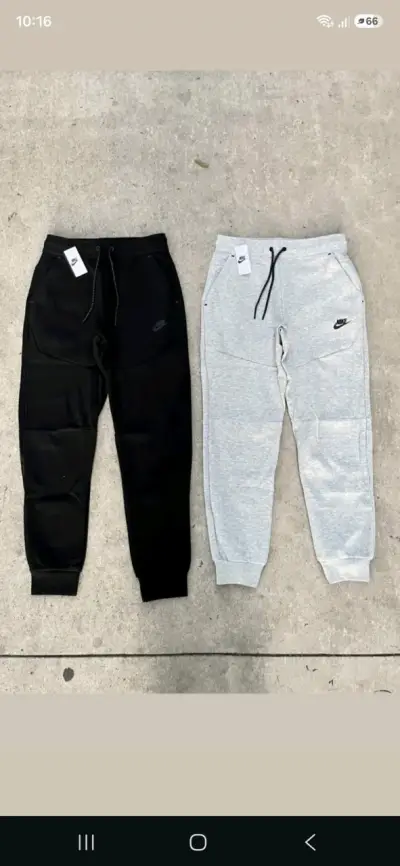 Pantalones deportivos Nike en negro y gris - miniatura 1