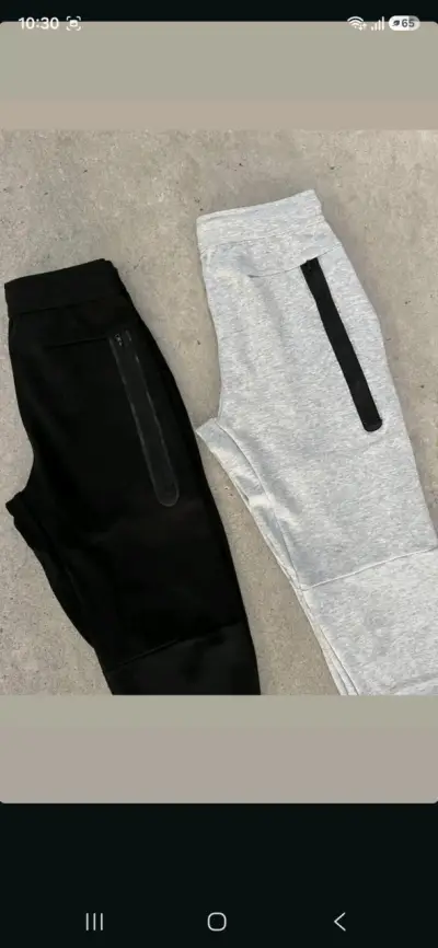Pantalones deportivos Nike en negro y gris - miniatura 2