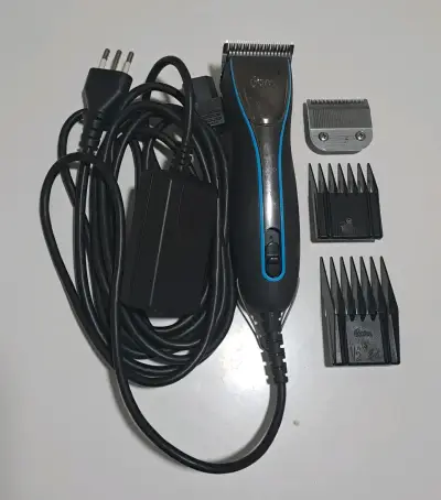 Máquina Oster A6 + cuchillo y peines de alzada. - miniatura 1