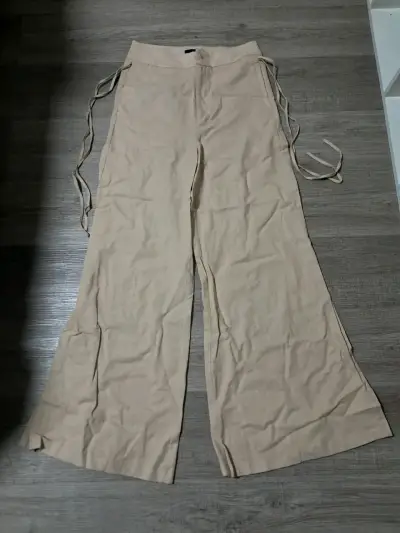 Pantalones beige de lino con lazos laterales - miniatura 1