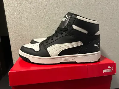 Zapatillas deportivas Puma negras y blancas - miniatura 1