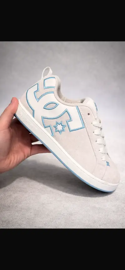 Zapatillas DC Shoes blancas con detalles azules - miniatura 1