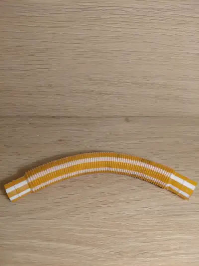 Juguete sensorial tubo flexible amarillo - miniatura 1