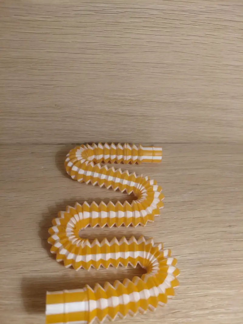 Juguete sensorial tubo flexible amarillo - 2