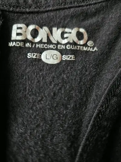 Polera sin mangas negra con texto "Eat Shop Sleep Repeat" - miniatura 5