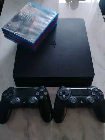 PS4 slim 1tb con dos controles y juegos incluidos - miniatura 1