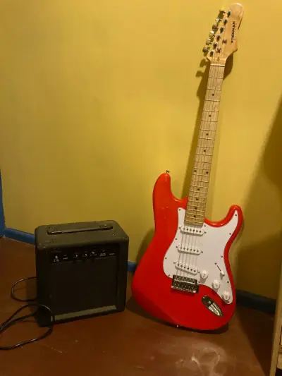 Guitarra eléctrica Freeman roja con amplificador - miniatura 1