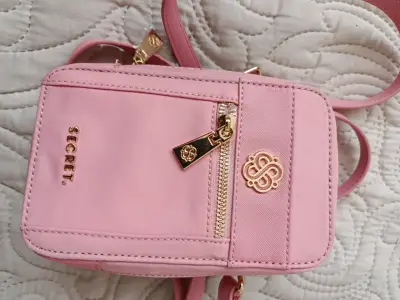 Bolso cruzado rosa Secret con detalles dorados - miniatura 1