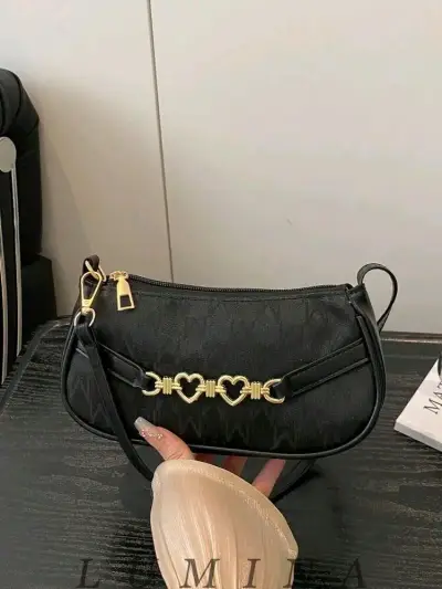 Cartera de mano negra con estampado animal print - miniatura 1
