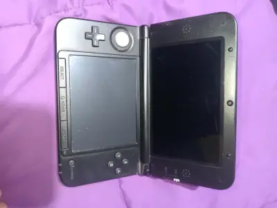 Consola Nintendo 3DS XL roja en buen estado - miniatura 1