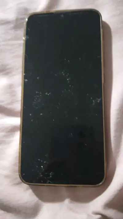 Teléfono Motorola con pantalla dañada - miniatura 1