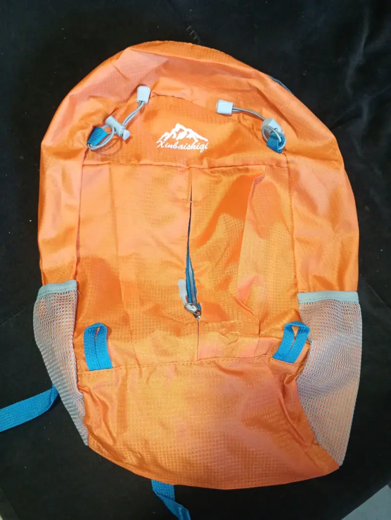 Mochila de senderismo naranja con bolsillos laterales - 1