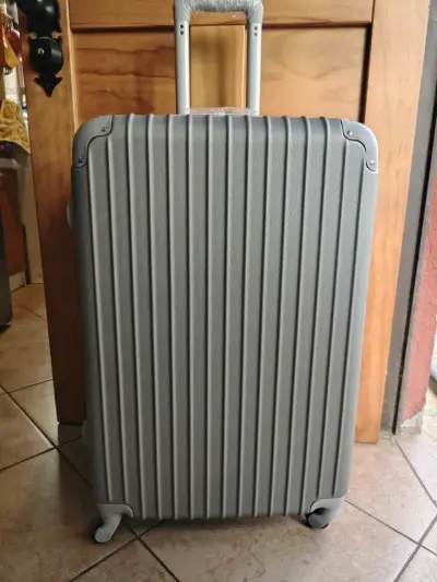 Maleta de viaje gris con ruedas giratorias - miniatura 1