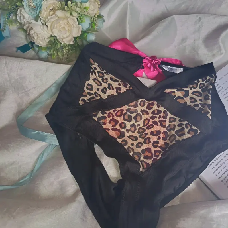 Panty de encaje con estampado animal y lazo rosa - 1
