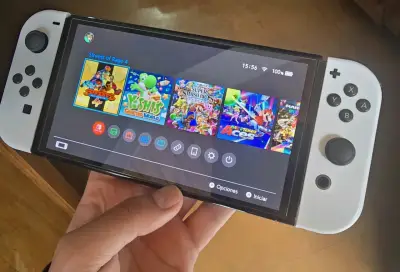 Nintendo Switch OLED con magia + 128gb - miniatura 1