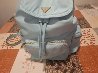 Mochila celeste Guess con bolsillos - miniatura 2