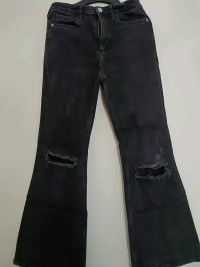 Jeans negros h&m flare talla 12 con roturas - miniatura 1