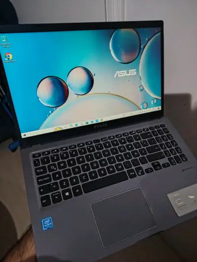 Notebook ASUS con Intel Celeron y pantalla HD - miniatura 1