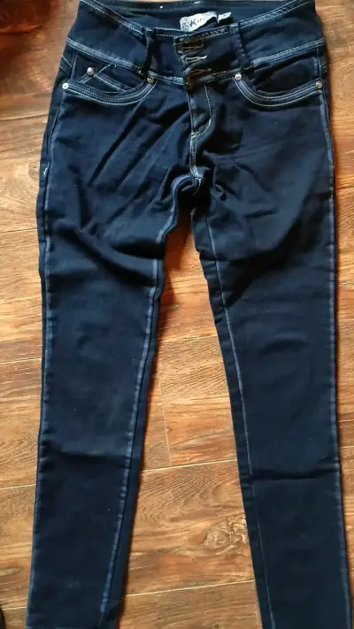 Jeans ajustados azul oscuro para mujer - miniatura 1