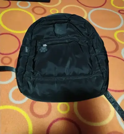 Mochila y mini bolsos $5.000 c/u - miniatura 1