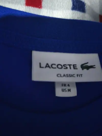 Polera Lacoste azul clásico para hombre - miniatura 1