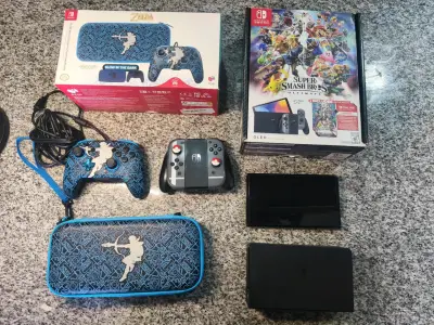 Nintendo Switch OLED con Super Smash Bros Ultimate y accesorios Zelda - miniatura 1
