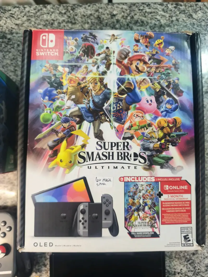 Nintendo Switch OLED con Super Smash Bros Ultimate y accesorios Zelda - 2